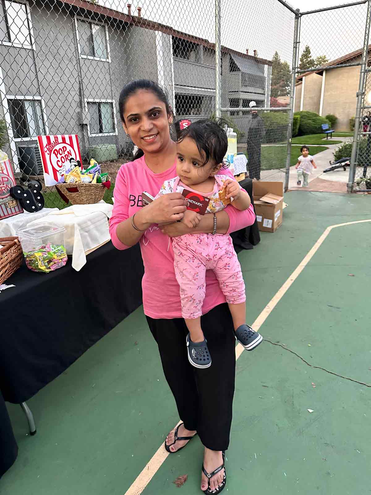 Woman holding a baby at the event